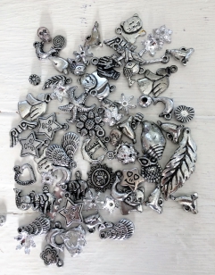 An Exciting Assorment of Silver Acrylic Charms, great for kids and parties +/ 80 grams