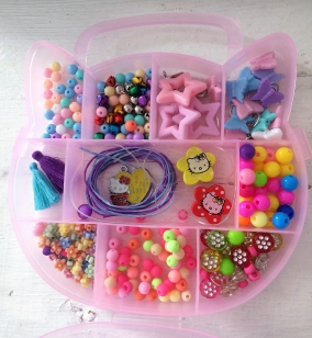 Bead Kit- Kitty- This is a Lovely Bead Kit for Girls aged 4-10 years old. Ideal for Party Packs or Beginners. The Box is in the shape of a Kitty. The Kit makes Bracelets and Necklaces. Makes a Lovely Gift. *Kits may vary
