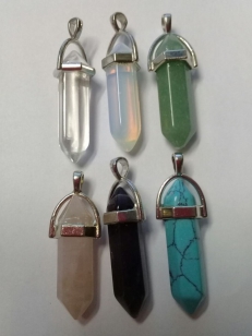 This is a Display of all the Gemstone Pendants (Crystal, Moonstone, Rose Quartz, Aventurine, Turquoise, Turquoise Green, Amethyst